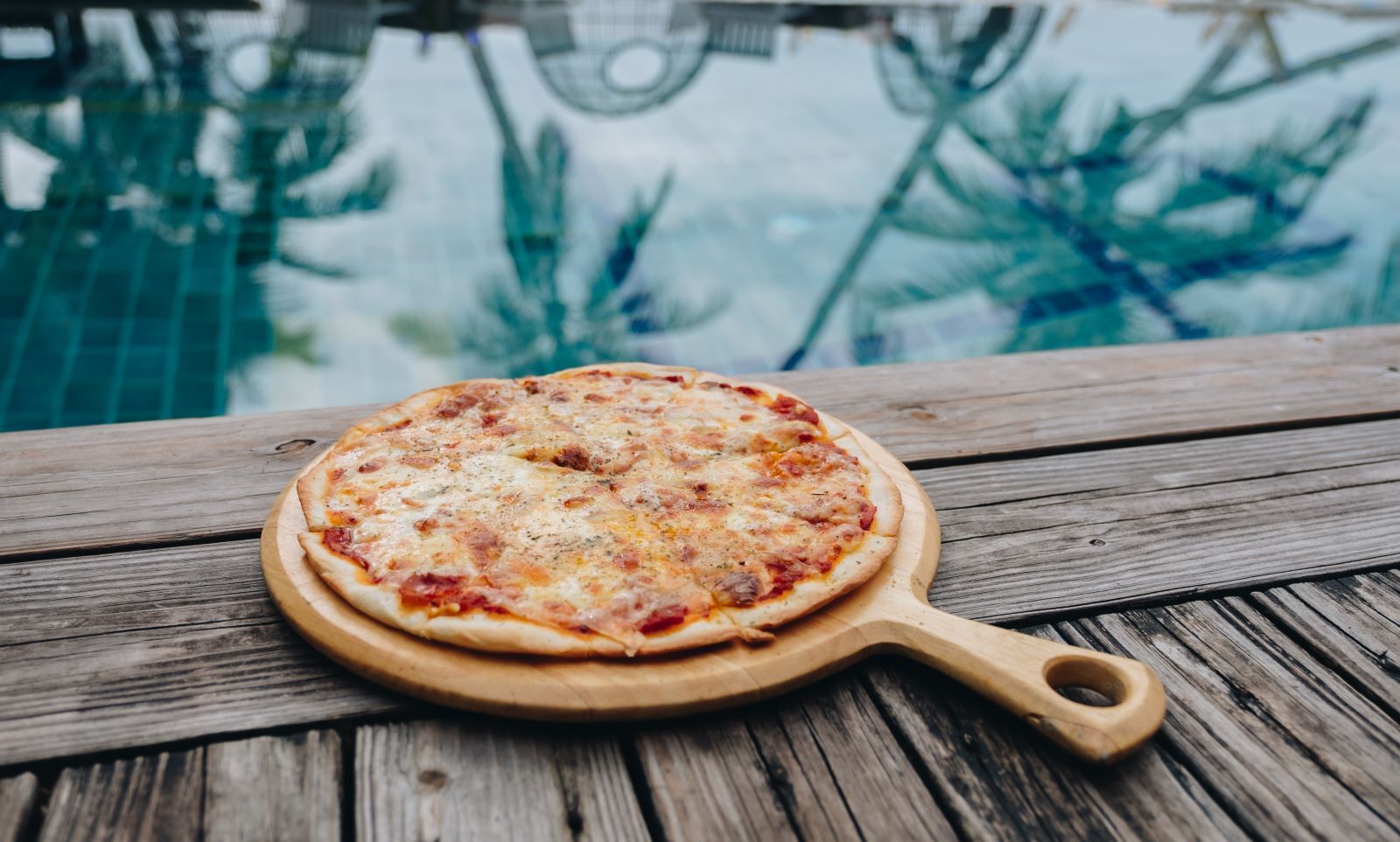 pizz-next-to-tropical-pool